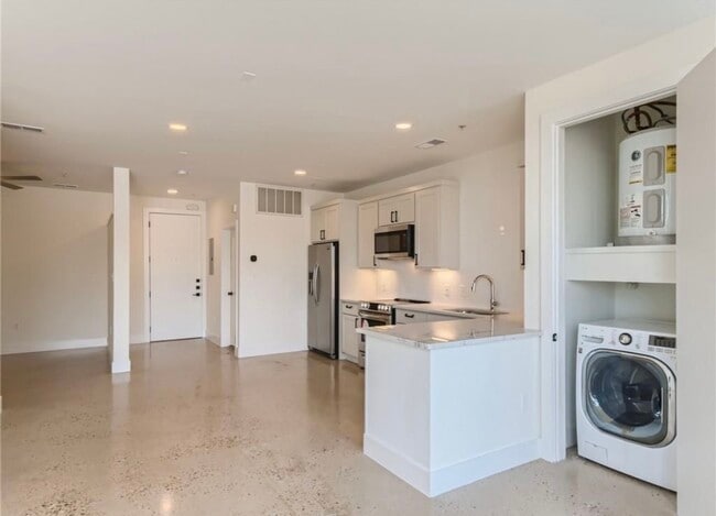 Polished concrete floors, all in one washer/dryer unit. - 2906 S 1st St