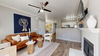 Located at 5102 E Piedmont Rd in Phoenix, AZ, this single-floor, 4-bedroom, 2-bathroom home offers a thoughtfully designed layout with a warm, neutral aesthetic throughout. Wood-look flooring runs continuously across the living spaces, complemented by crown molding and ceiling fans that enhance the clean, modern feel.

The living room serves as the heart of the home, featuring a white fireplace, large windows with vertical blinds that invite natural light, and direct access to an outdoor area via a glass-paneled door. It flows seamlessly into the dining area, which is brightened by a contemporary sputnik chandelier and a wide window, and connects to the kitchen. The kitchen features white cabinetry, stainless steel appliances including a refrigerator, range, and microwave, a peninsula with a sink, and track lighting overhead.

The spacious primary bedroom includes a generously sized walk-in closet with built-in wire shelving systems. Both bathrooms are finished with wood-look flooring, white cabinetry, and one features a soaking tub. The remaining bedrooms are well-proportioned with ample natural light. A dedicated laundry area houses a full-size washer and dryer. The home's cohesive design, practical layout, and Phoenix location make it a well-rounded residential space.