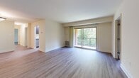 Located at 805 Roundtop Ct in Lutherville Timonium, Maryland, this single-floor, three-bedroom, one-bathroom home offers a well-organized layout with consistent hardwood-style flooring throughout, lending a clean and cohesive feel to the entire space.

The living room is a bright and open area featuring a sliding glass door that leads to a private balcony overlooking lush, mature trees — a standout feature that brings natural light and greenery into the heart of the home. The living area connects seamlessly to the kitchen, which is outfitted with dark espresso cabinetry, granite countertops, a stainless steel sink, and a full suite of stainless steel appliances including a refrigerator, gas range, and microwave. Generous upper and lower cabinet storage makes the galley-style kitchen both functional and visually appealing.

The spacious primary bedroom offers ample room and benefits from natural light through large windows with blinds. The two additional bedrooms are well-proportioned with arched-panel white doors and easy access to the shared hallway. The full bathroom features tile flooring, a tub-shower combination, a dark wood vanity with a white countertop, and overhead lighting. Neutral warm tones and clean white trim are carried throughout, creating a calm and move-in ready atmosphere.
