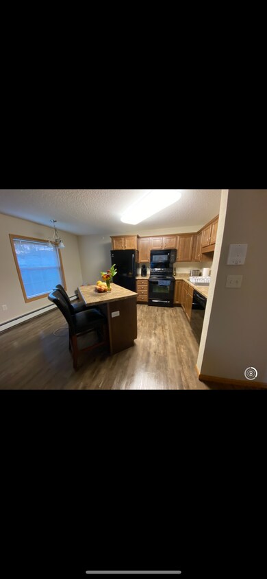 Up to date kitchen with a lot of storage and an island - 601 Boulder Dr