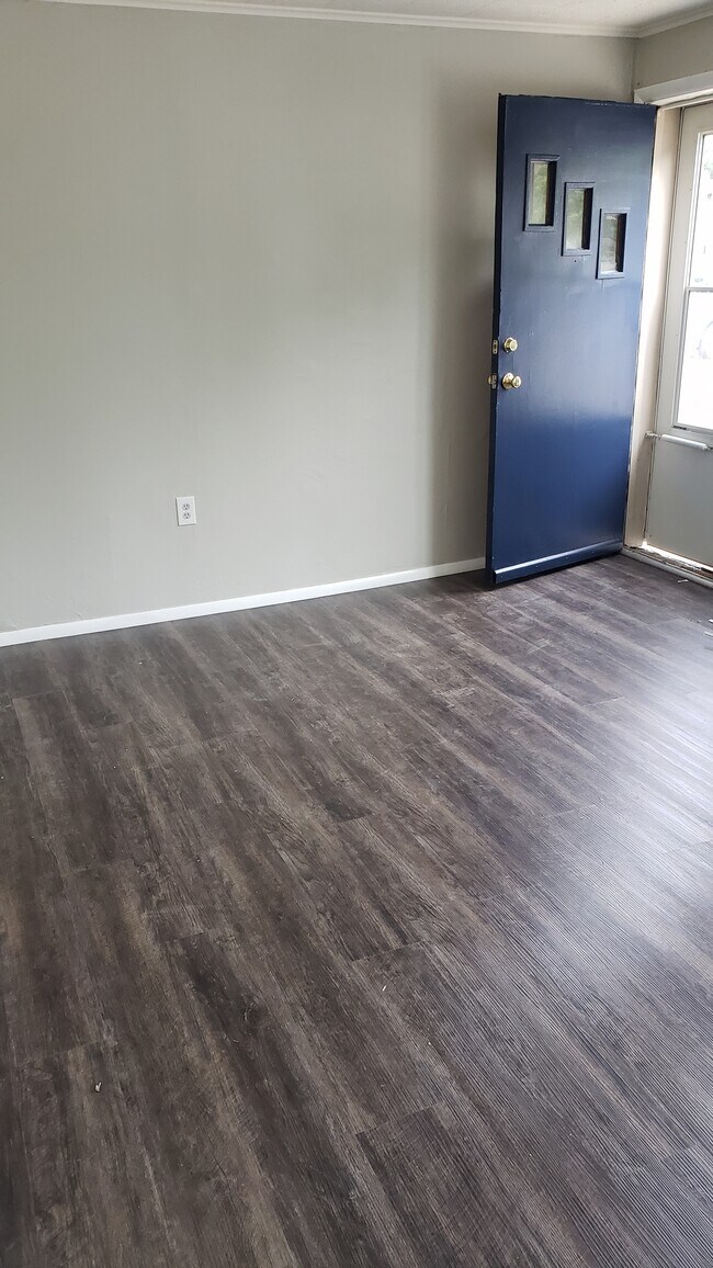 Brand new vinyl plank flooring looks great with new repose gray paint. - 1113 2nd St