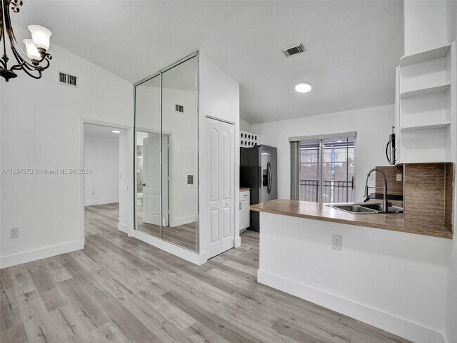 Building Photo - 11001 W Okeechobee Road 201, Hialeah Garde...