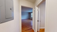 Located at 88 Woodland Rd in the desirable Short Hills neighborhood of New Jersey, Unit 3 is a single-floor residence that combines classic details with functional living spaces. Warm hardwood flooring runs consistently throughout the unit, lending a cohesive and inviting character to every room.

The layout, as visible in the floor plan, features a well-proportioned living area, multiple bedrooms, a kitchen, and a bathroom. The living and bedroom spaces are dressed in neutral tones and benefit from natural light streaming through double-pane windows fitted with blinds, with baseboard heating units present in each room for year-round comfort.

The kitchen is equipped with stainless steel appliances, including a Whirlpool gas range and an over-the-range microwave, complemented by a mosaic tile backsplash. A large window positioned beside the range brings in ample natural light.

One room features a built-in shelving and cabinetry unit, offering practical storage and display space. The bathroom presents a clean, all-white aesthetic with a tiled tub-and-shower combination, a white vanity with under-sink storage, and wood-look tile flooring. Throughout the unit, crisp white trim and panel doors add a timeless architectural touch that ties the space together.