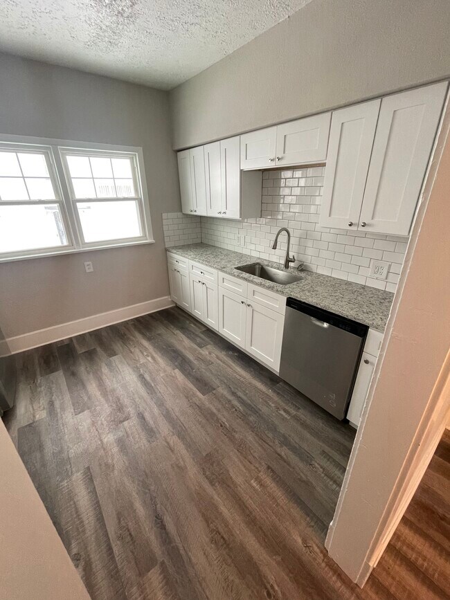 Kitchen includes new soft-close cabinets and granite countertops - 3185 Sycamore Rd