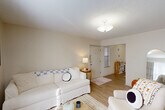 Located at 2200 N Morrison Blvd in Hammond, Louisiana, this well-organized 2-bedroom, 1-bathroom unit offers a practical and comfortable single-floor layout. The living room features light wood-style flooring, a textured ceiling, and a welcoming front entry with a window that allows natural light to filter in. A hallway connects the main living areas to the private bedrooms, with an impressive five closets distributed throughout the unit for generous storage.

The combined kitchen and dining area is efficiently designed, featuring an L-shaped kitchen with taupe cabinetry, a full suite of appliances including a range, dishwasher, and refrigerator, and durable wood-style flooring. The adjacent dining space accommodates a cozy table and chairs.

Both bedrooms are carpeted and offer a quiet retreat. The primary bedroom provides a comfortable amount of space with its own closet access, while the second bedroom benefits from a large window that brings in abundant natural light.

The shared bathroom includes a warm wood-toned vanity with a granite-style countertop and a broad mirror. Throughout, the unit maintains a neutral, light color palette with textured ceilings, creating a clean and cohesive atmosphere.