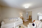 Located at 2200 N Morrison Blvd in Hammond, Louisiana, this well-organized 2-bedroom, 1-bathroom unit offers a practical and comfortable single-floor layout. The living room features light wood-style flooring, a textured ceiling, and a welcoming front entry with a window that allows natural light to filter in. A hallway connects the main living areas to the private bedrooms, with an impressive five closets distributed throughout the unit for generous storage.

The combined kitchen and dining area is efficiently designed, featuring an L-shaped kitchen with taupe cabinetry, a full suite of appliances including a range, dishwasher, and refrigerator, and durable wood-style flooring. The adjacent dining space accommodates a cozy table and chairs.

Both bedrooms are carpeted and offer a quiet retreat. The primary bedroom provides a comfortable amount of space with its own closet access, while the second bedroom benefits from a large window that brings in abundant natural light.

The shared bathroom includes a warm wood-toned vanity with a granite-style countertop and a broad mirror. Throughout, the unit maintains a neutral, light color palette with textured ceilings, creating a clean and cohesive atmosphere.