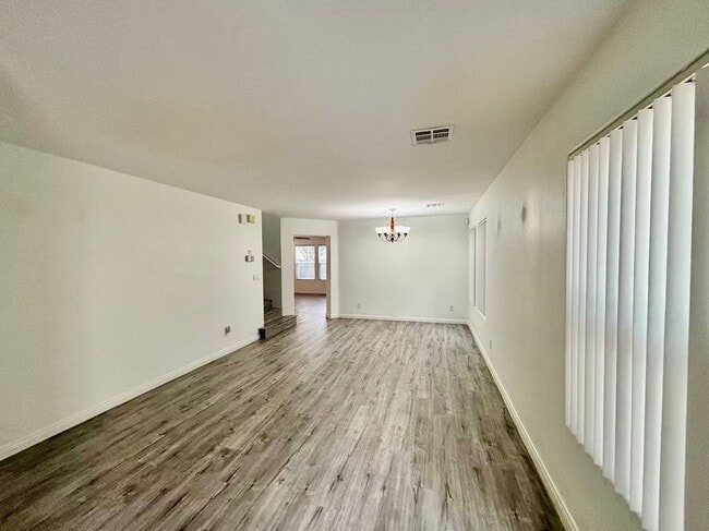 Building Photo - Welcome to this charming 4 bedroom, 2.5 bathroom home.