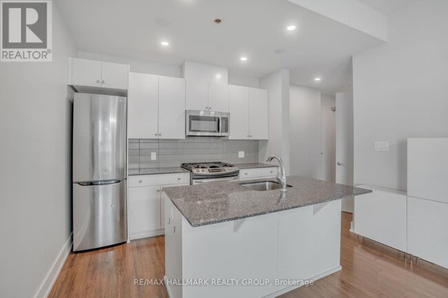 Building Photo - 100 Champagne Ave S