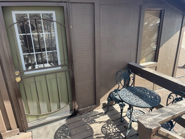 Entry way with patio table included. Security door is an extra bonus! - 1506 N West St