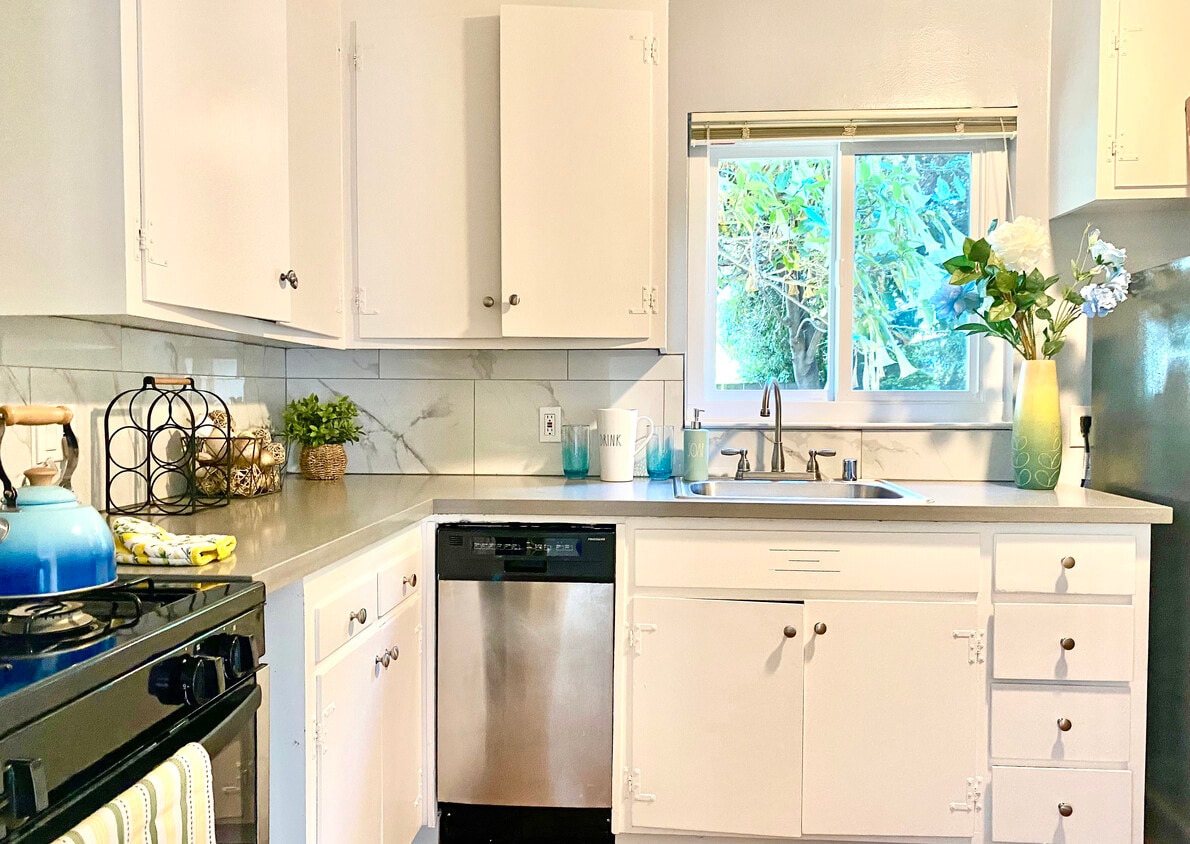 Kitchen with quartz countertops and stainless appliances - 1114 Stannage Ave