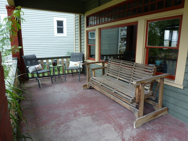 Front porch - swing stays with house - 1106 N Keystone Ave