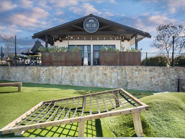 Press Café at The District offers a relaxed outdoor setting for coffee or bites, just minutes from Modera Walsh Heights. - Modera Walsh Heights