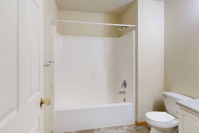 Our bathrooms feature a full-size tub and shower, perfect for relaxing and refreshing. - Northbrook Apartments