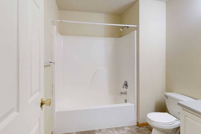 Our bathrooms feature a full-size tub and shower, perfect for relaxing and refreshing. - Northbrook Apartments