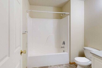 Our bathrooms feature a full-size tub and shower, perfect for relaxing and refreshing. - Northbrook Apartments