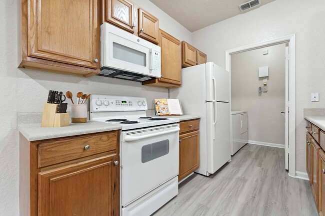 Kitchen with white appliances - Grandeville on Saxon