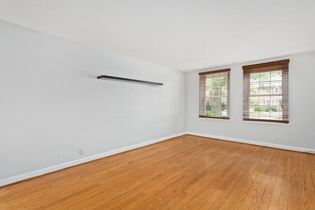 Living room w/ fresh paint, HW floors, natural light, & blinds - 4218 35th St S