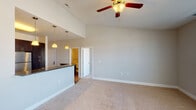 Located at 320 Continental Cir in Christiansburg, Virginia, this single-floor residence offers a thoughtfully designed open-concept layout that seamlessly connects the living and kitchen areas. The kitchen is a standout feature, showcasing rich dark cabinetry, deep granite countertops, stainless steel appliances including a range and built-in microwave, and hardwood-style flooring. A raised breakfast bar with elegant pendant lighting provides a natural transition into the living area, which is finished with plush neutral carpet and a ceiling fan overhead. The elevated ceilings in the living space lend an airy, open feel to the interior.

The bedrooms are generously sized, each equipped with ceiling fans, soft carpeting, and windows that bring in natural light and views of the surrounding neighborhood. The primary bedroom includes direct access to an en-suite bathroom featuring dark vanity cabinetry and granite countertops. Additional bathrooms are finished with tile flooring, granite vanity surfaces, and a full tub-shower combination. Throughout the residence, neutral wall tones and clean architectural lines create a calm and cohesive aesthetic. A balcony access door is also visible, offering outdoor connectivity to the surrounding Christiansburg community.