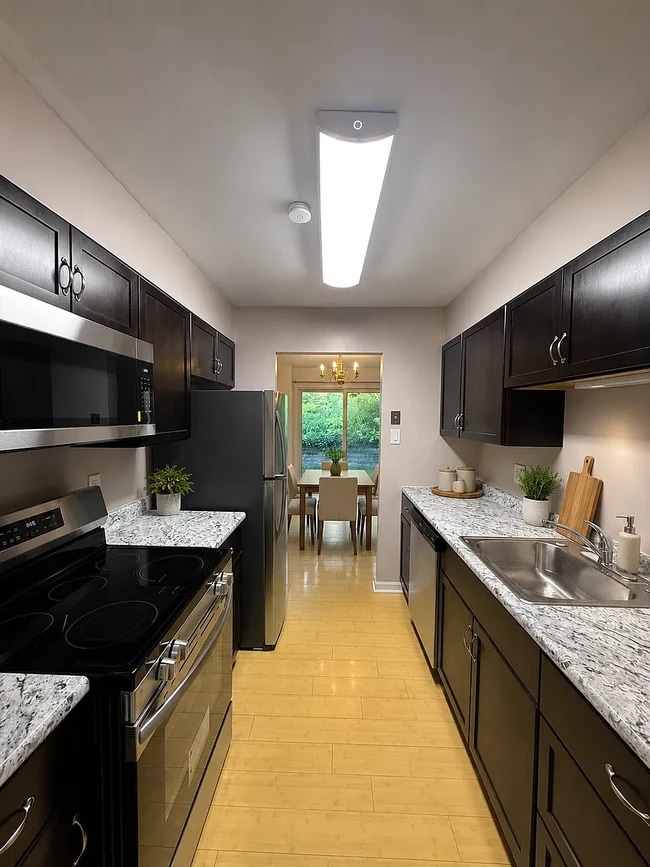 Kitchen with brand new oven, dishwasher, refrigerator, and microwave - 2816 Bingham Dr