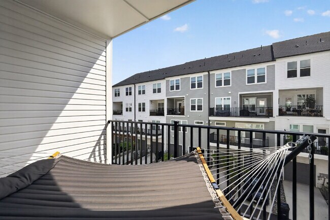 Building Photo - Stunning 2-Level Top Floor Condo with Tesla Charger & 70" TV – Farmstead District