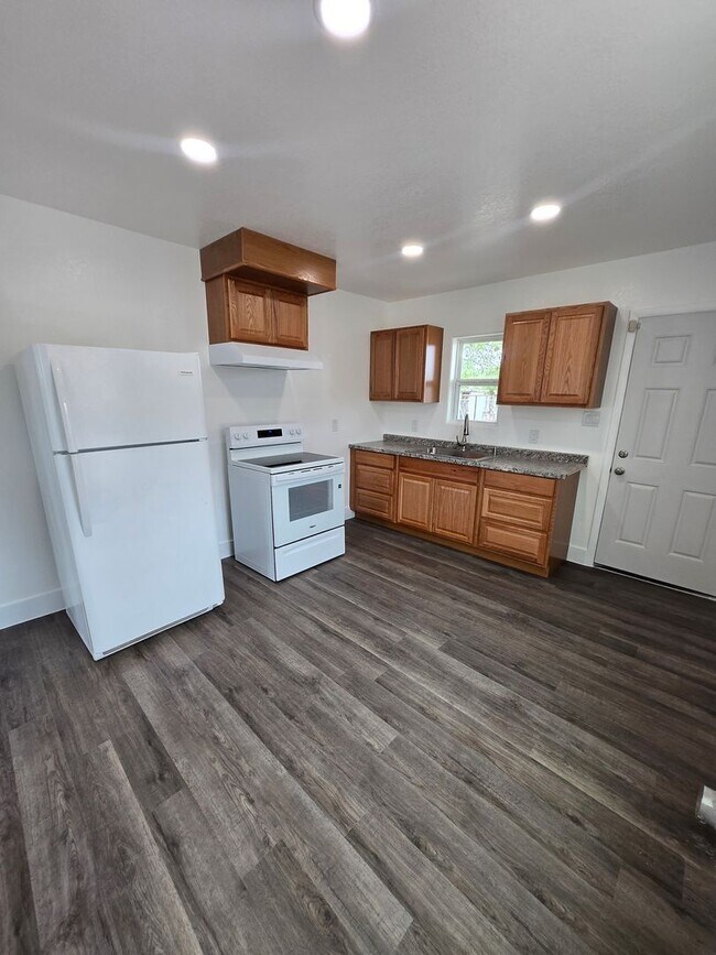 Building Photo - New paint and flooring throughout.