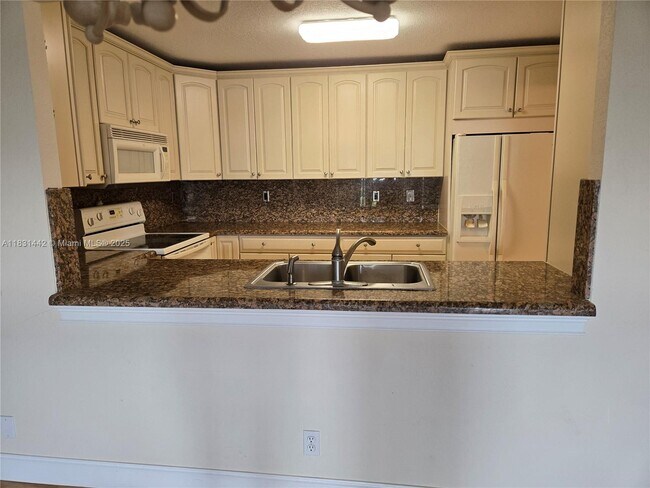 Building Photo - 10777 W Sample Rd