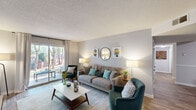 Located at 505 Bertram Ct in Augusta, GA, this single-floor residence offers a thoughtfully arranged 2-bedroom, 2-bathroom layout. The inviting living room features wood-style flooring, neutral walls, and a sliding glass door that opens to an outdoor balcony, allowing natural light to fill the space. The open sightline connects the living area to the dining room, which showcases hardwood-style floors, chair-rail molding, and room for a full dining set — ideal for entertaining. The galley-style kitchen is outfitted with dark wood cabinetry, light quartz countertops, and modern appliances including a dishwasher and range. The generously sized primary bedroom is carpeted for comfort, features a natural window view with outdoor greenery, and includes a dedicated closet with built-in shelving. The second bedroom mirrors this comfortable layout. Both bathrooms include tub-shower combinations. A dedicated in-unit laundry area accommodates a full-size washer and dryer with overhead shelving for added storage. Throughout the home, the consistent use of neutral tones, wood-style flooring, and carpet in the bedrooms creates a cohesive and comfortable living environment.
