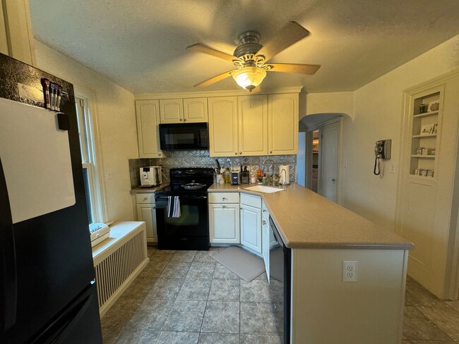 Building Photo - Charming Cape Cod Home with Updated Kitche...