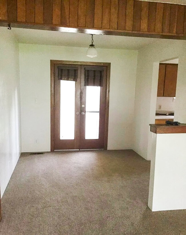 Dining room, kitchen and laundry pantry space to the right. These doors lead to back yard - 901 King St