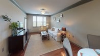 Located at 161 Village View Drive in Mooresville, NC, this single-story home offers a well-organized layout with multiple living spaces designed for everyday comfort. The floor plan, as seen in the 3D overview, reveals a thoughtfully arranged interior with distinct living, sleeping, and utility zones.

The living room features warm hardwood-style flooring, crown molding, and windows that allow natural light to brighten the neutral-toned walls. The kitchen is outfitted with rich dark cabinetry, granite countertops, a tile backsplash, black appliances, and pendant lighting above the counter, creating a functional and visually cohesive cooking space.

Multiple bedrooms offer carpeted floors and sizable closets, with the primary bedroom featuring sliding glass doors that open to an outdoor area. The primary bathroom includes a walk-in shower with tile surround, a soaking tub, hardwood-style flooring, granite vanity, and access to a walk-in closet. A secondary bathroom provides a tiled tub-shower combination with a granite vanity. A dedicated laundry room houses a full-size washer and dryer with overhead shelving for added storage.
