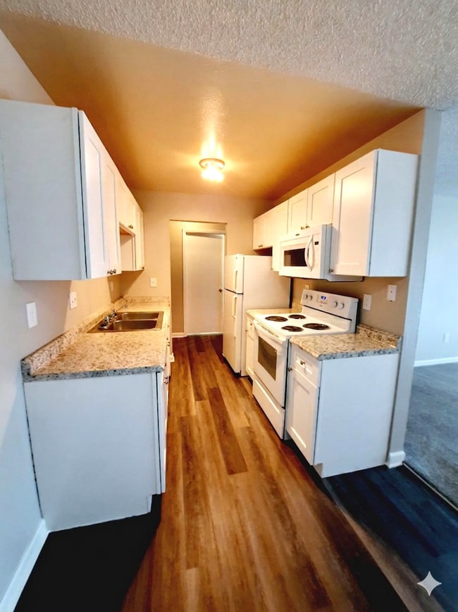 Building Photo - SUNDANCER APARTMENTS