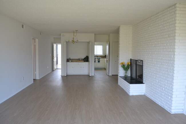 Dining Area and Living Room with Fireplace - The Continental Arcadia