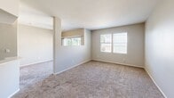 Located at 7149 Navajo Rd in the College Area neighborhood of San Diego, CA, this single-story 2-bedroom, 2-bathroom home offers a well-organized and functional layout. The kitchen is a standout feature, showcasing dark espresso Shaker-style cabinetry, light quartz countertops, wood-look flooring, and a full suite of stainless steel appliances including a gas range, built-in microwave, dishwasher, and refrigerator. A double-basin sink with a modern gooseneck faucet anchors the kitchen peninsula. The open living area is carpeted and filled with natural light through multiple windows with blinds, creating a bright and comfortable atmosphere. Both bedrooms are carpeted and generously sized, with the primary bedroom offering corner windows that bring in ample natural light. Each bedroom includes dedicated closet space. The two full bathrooms are finished consistently, featuring dark wood vanities with quartz-style counters, tub/shower combinations with white tile surrounds, and wood-look flooring. One bathroom includes a window above the tub for added natural light. The neutral color palette and clean finishes throughout lend the home a cohesive, move-in-ready appeal.