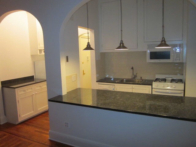 Open kitchen with cupboards to ceiling - 26 W 97th St