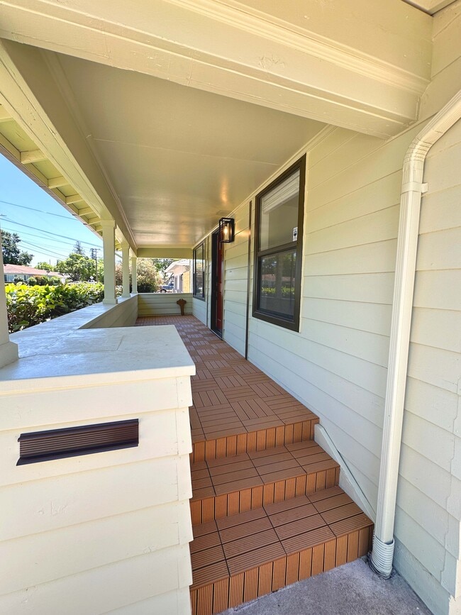 Beautifully remodeled front porch—perfect for relaxing evenings or morning coffee. - 4570 58th St
