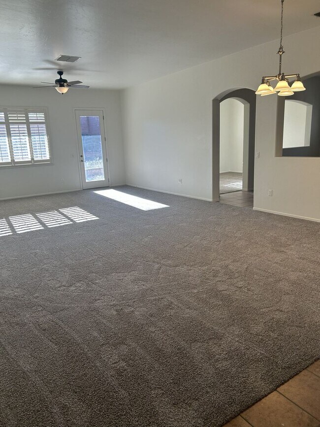 Building Photo - Unfurnished four bedroom large home!  Three car garage