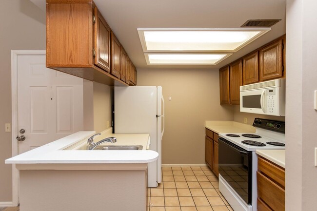 Photo - Cozy 2-Bed Condo with Fireplace, Garage & Pool Access Near Shopping!