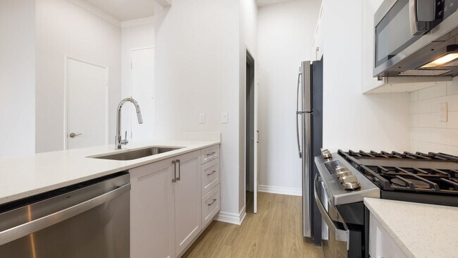 Kitchen with Stainless Steel Appliances - Arlo Woodland Hills
