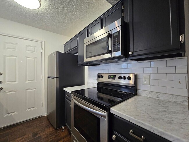 Building Photo - RENT REDUCTION - AVAILABLE NOW!