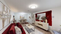 Located at 4254 Maple Leaf Dr in New Orleans, LA, this well-appointed 2-bedroom, 2-bathroom single-floor home offers a thoughtfully designed layout that maximizes comfort and functionality. Light-toned hardwood-style flooring runs throughout, tying the spaces together with a cohesive, modern aesthetic.

The open-concept living and dining area forms the heart of the home. The living room is bright and welcoming, featuring large windows that invite natural light and a bold accent wall that adds visual depth. The dining area is defined by an elegant chandelier and ample room for gathering, flowing naturally from the living space.

The primary bedroom is generously proportioned, offering a serene retreat with neutral tones and room for a full furniture arrangement. A dedicated vanity nook with a marble-top counter and lighted mirror provides a refined, functional touch. The second bedroom benefits from a large window with natural views and versatile space suited for sleeping or a home office setup.

Both bathrooms are cleanly finished and practical. A dedicated in-unit laundry room with side-by-side washer and dryer hookups and built-in shelving adds everyday convenience. Throughout the home, clean white walls, consistent flooring, and curated architectural details create a polished, move-in-ready atmosphere.