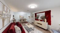Located at 4254 Maple Leaf Dr in New Orleans, LA, this well-appointed 2-bedroom, 2-bathroom single-floor home offers a thoughtfully designed layout that maximizes comfort and functionality. Light-toned hardwood-style flooring runs throughout, tying the spaces together with a cohesive, modern aesthetic.

The open-concept living and dining area forms the heart of the home. The living room is bright and welcoming, featuring large windows that invite natural light and a bold accent wall that adds visual depth. The dining area is defined by an elegant chandelier and ample room for gathering, flowing naturally from the living space.

The primary bedroom is generously proportioned, offering a serene retreat with neutral tones and room for a full furniture arrangement. A dedicated vanity nook with a marble-top counter and lighted mirror provides a refined, functional touch. The second bedroom benefits from a large window with natural views and versatile space suited for sleeping or a home office setup.

Both bathrooms are cleanly finished and practical. A dedicated in-unit laundry room with side-by-side washer and dryer hookups and built-in shelving adds everyday convenience. Throughout the home, clean white walls, consistent flooring, and curated architectural details create a polished, move-in-ready atmosphere.