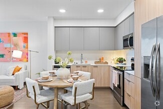 Cook, dine, and unwind in this beautifully designed modern kitchen and dining space, where style meets everyday functionality. - The Grant