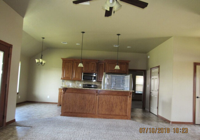 Kitchen/Dining Room from Living Room - 1517 NE Stone House Dr