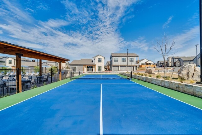 Pickleball court with our homes in the background - parcHAUS at Paloma Creek