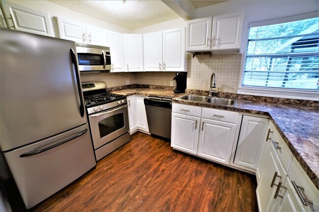 Stainless appliances and gas stove - 690 NE 23rd Ave