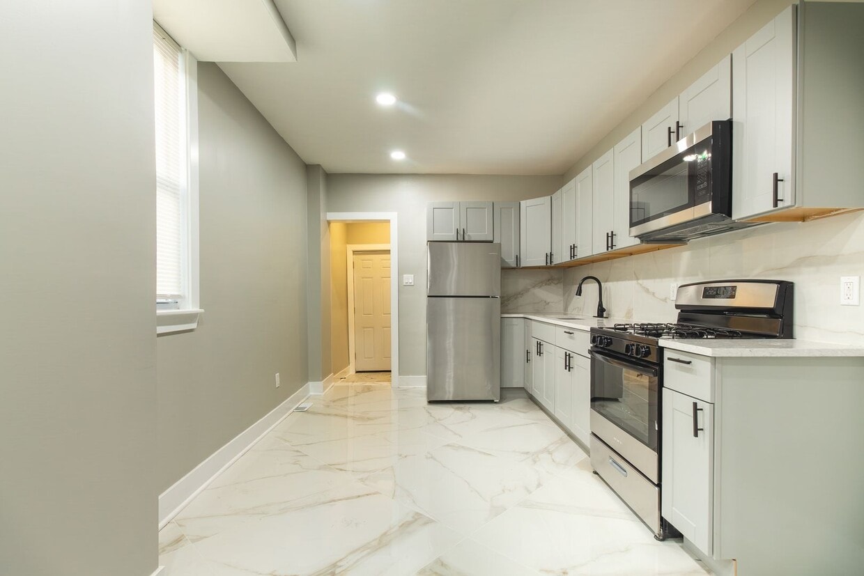 Primary Photo - Spacious 3-Bedroom Single-Family Row Home ...