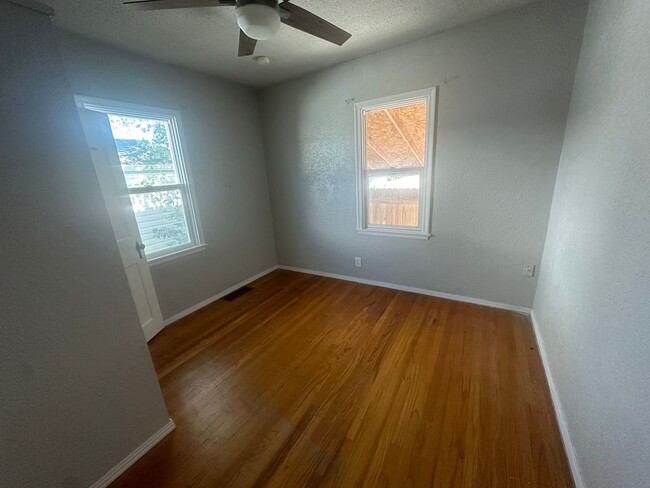 Building Photo - Three Bedroom, Two Bathroom Home! One car ...