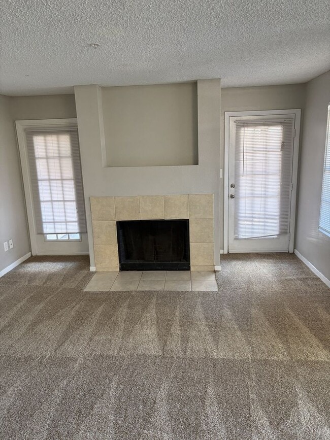 Photo - 1st floor unit with fire place and large patio House