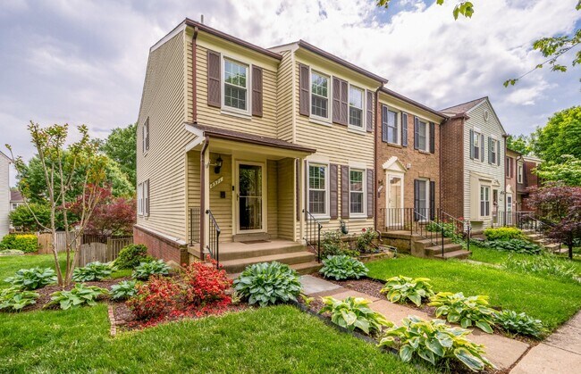 Building Photo - This end unit boasts four bedrooms and thr...