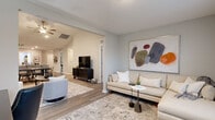 Located at 35 Lucy Ridge Rd in Delaware, Ohio, this single-story home offers a thoughtfully designed layout across two bedrooms, three bathrooms, and a generous assortment of functional spaces. The open-concept kitchen and living area serves as the heart of the home, featuring dark espresso cabinetry, granite-look countertops, stainless steel appliances, recessed lighting, and durable wood-look flooring that flows seamlessly throughout. A dedicated living room provides a warm, inviting retreat with neutral tones and natural light streaming through large windows. The spacious primary bedroom is a comfortable haven, complete with plush carpeting, a ceiling fan, and bright windows offering pleasant outdoor views. A walk-in closet with built-in wire shelving provides ample storage. The bathrooms are finished with marble-look tile flooring, dark vanity cabinetry, and granite-style countertops, with a tub-shower combo featured in at least one bath. A versatile second bedroom is well-suited as a guest room or home office, featuring hardwood-look floors and generous natural light. The dedicated laundry room houses full-size GE front-load washer and dryer units with overhead shelving. An attached garage with concrete flooring and an electrical panel completes this practical and stylish home.